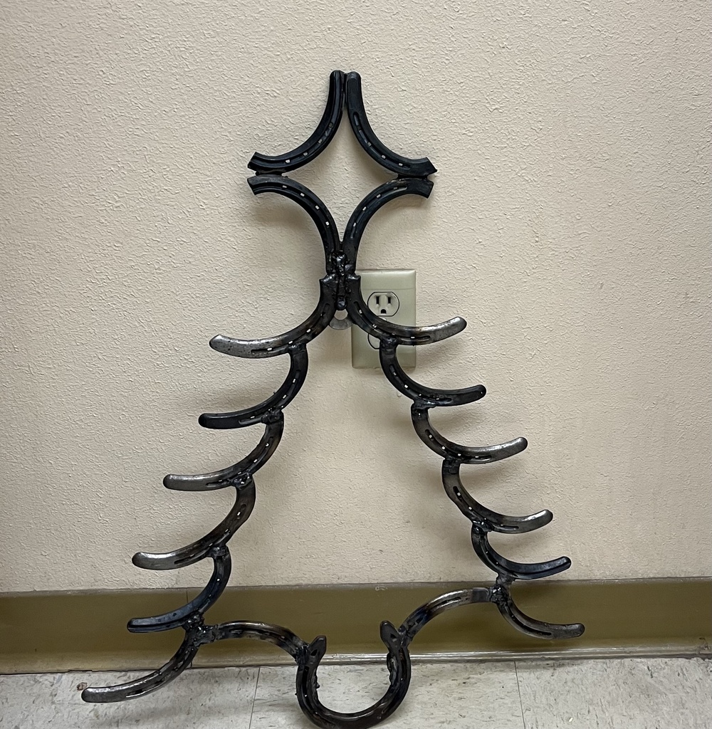 Welded Christmas tree made out of horseshoes.