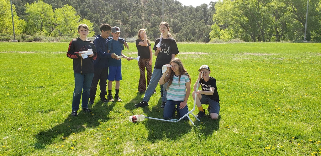 Students with stomp rockets and spotters.